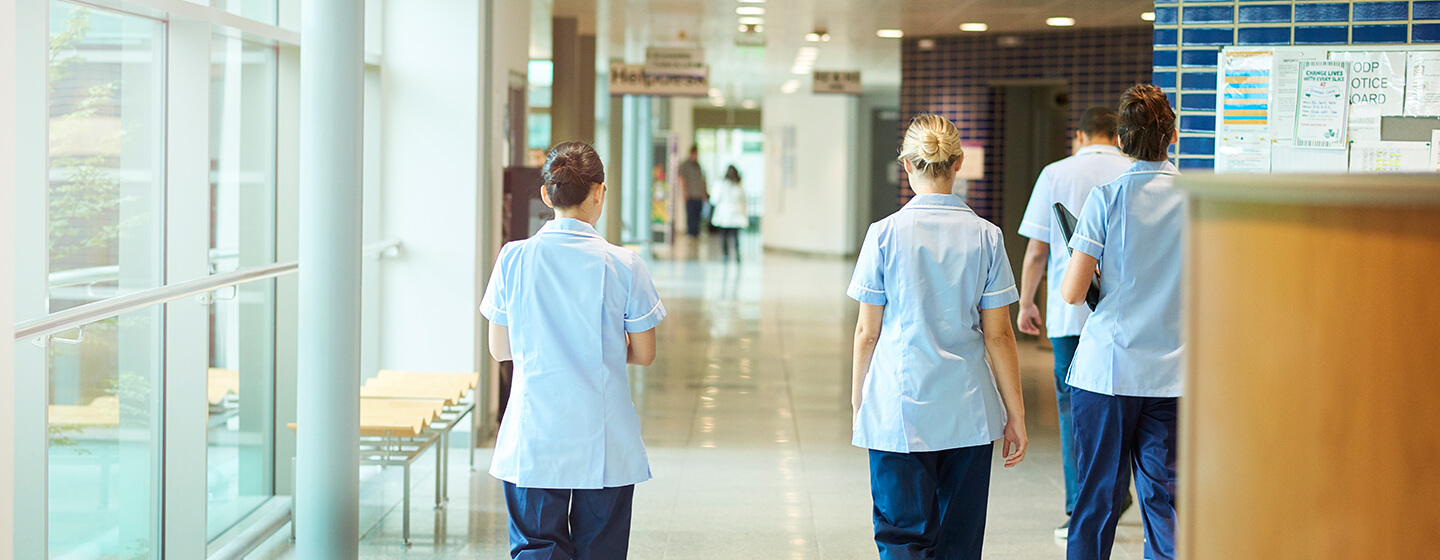 Nurses walking down a public sector hospital corridor 
